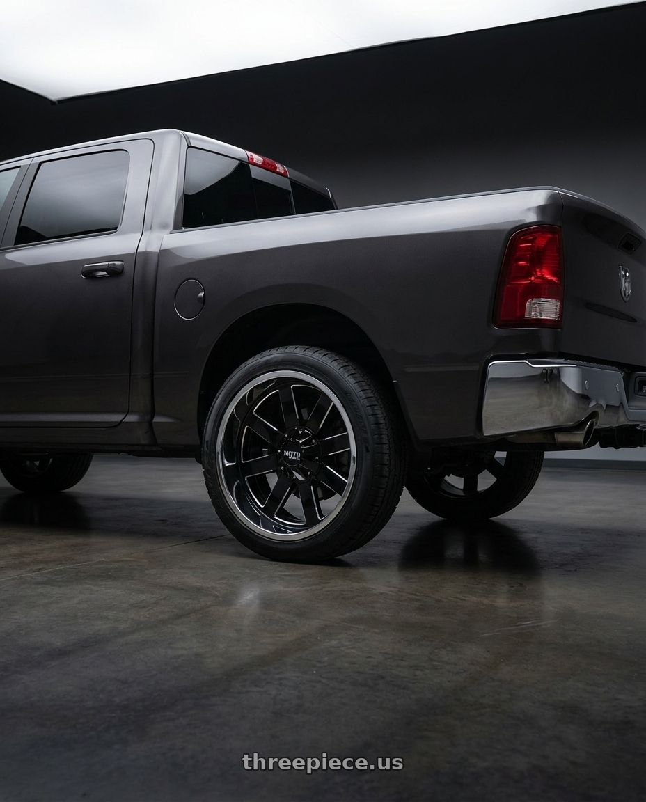 2024 Ram 1500 with Moto Metal MO200 6X139.7 22X10 -18 GLOSS BLACK MILLED CENTER CHROME LIP wheels rear three quarter view meaty tires