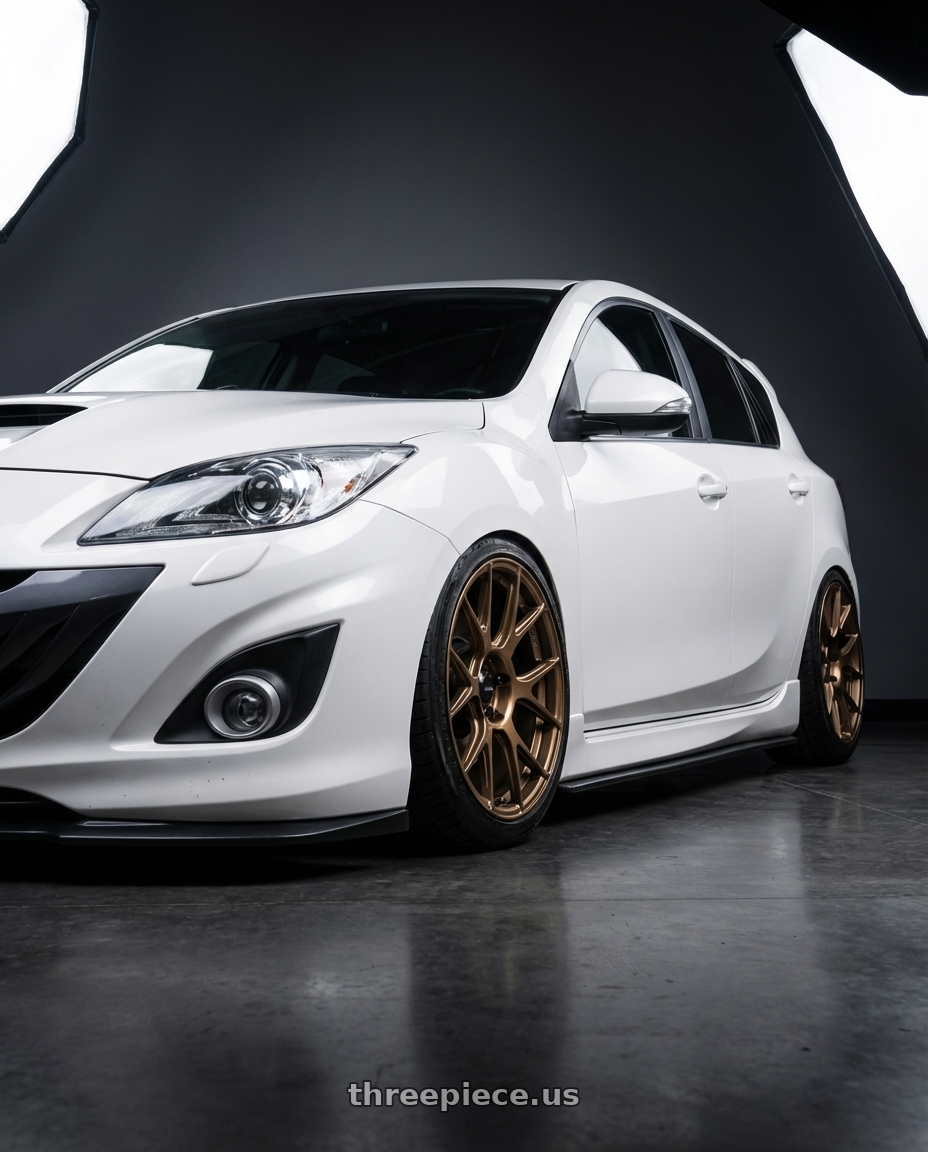 2012 Mazda Mazdaspeed3 with Konig Ampliform 5x114.3 18x9.5+25 Gloss Bronze wheels