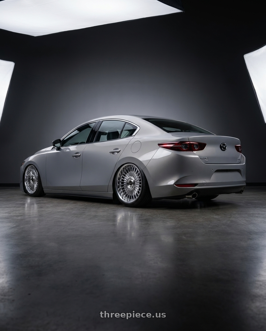 2022 mazda 3 turbo awd with Work Emitz wheels rear three quarter view slight stretch tires