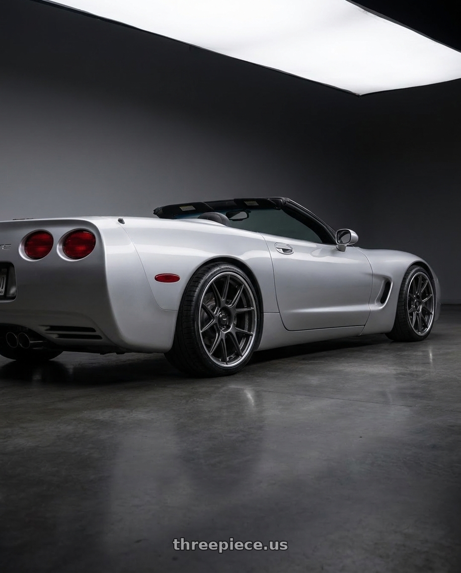 2000 Chevrolet corvette with Konig Ampliform 5x114.3 19x9.5+25 Dark Metallic Graphite wheels rear three quarter view square tires