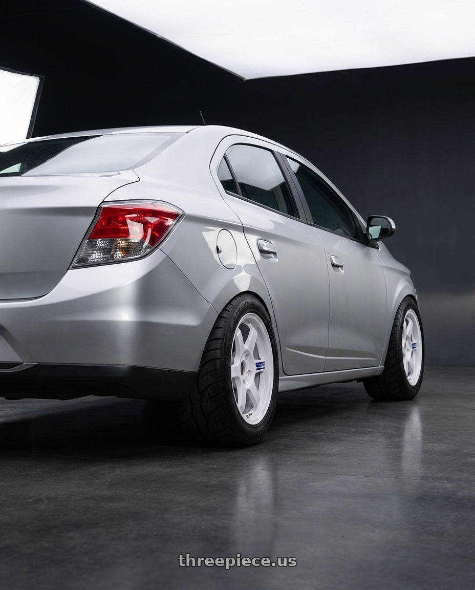 2011 Chevrolet Astra Advantage 2 with Volk Racing TE37 Gravel 5x114.3 15x7.0+35 White wheels rear three quarter view meaty tires