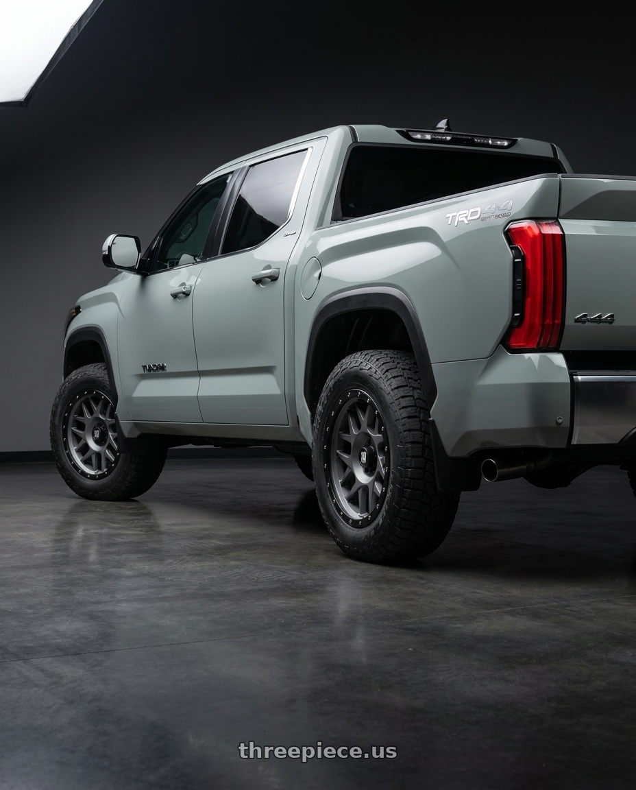 2024 Toyota Tundra with XD XD127 BULLY 6X139.7 20X9 +0 MATTE GRAY BLACK RING wheels rear three quarter view meaty tires