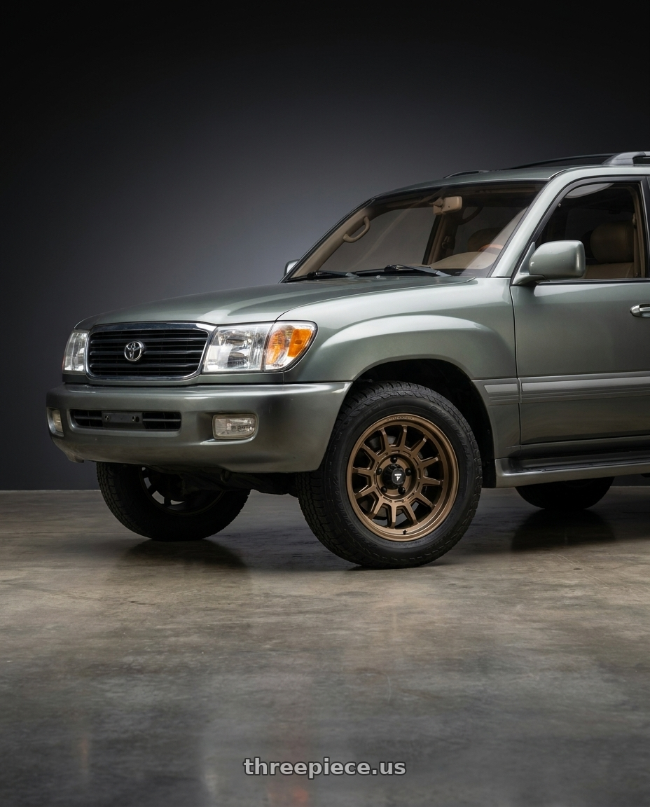 1999 Toyota Land Cruiser with Fittipaldi Offroad FT102Z 5X150 17x8.5 +0 Satin Bronze wheels