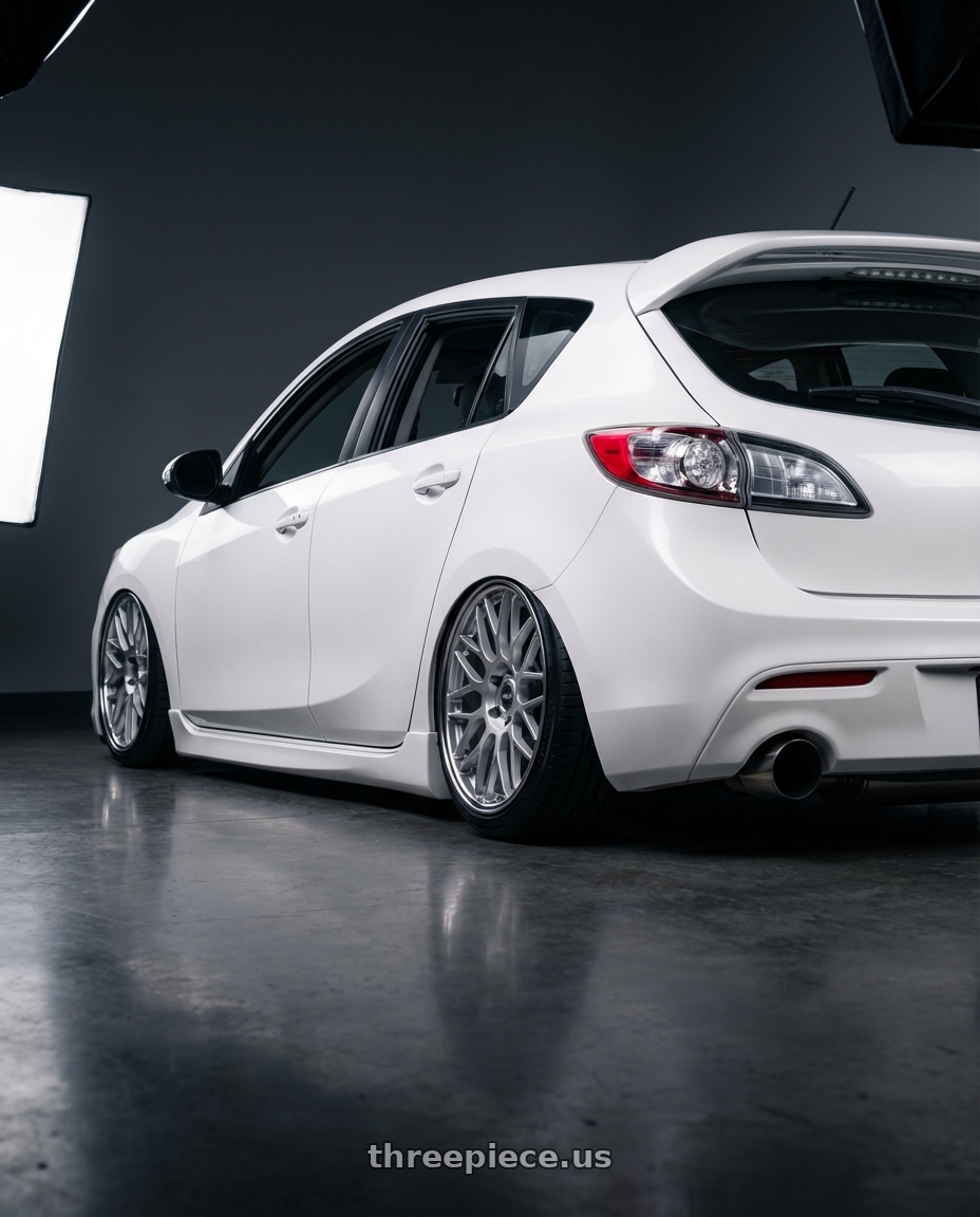 2012 Mazda Mazdaspeed3 with ESR Wheels APEX SERIES APX01 5x114.3 18x9.5 +22 Hyper Silver wheels rear three quarter view slight stretch tires