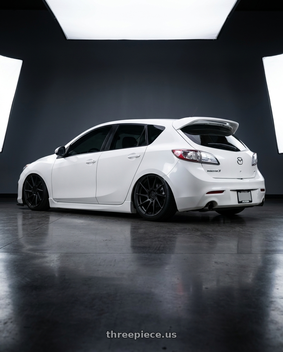 2012 Mazda Mazdaspeed3 with Aodhan AH09 5x114.3 18x8.5 +35 Matte Black wheels rear three quarter view slight stretch tires