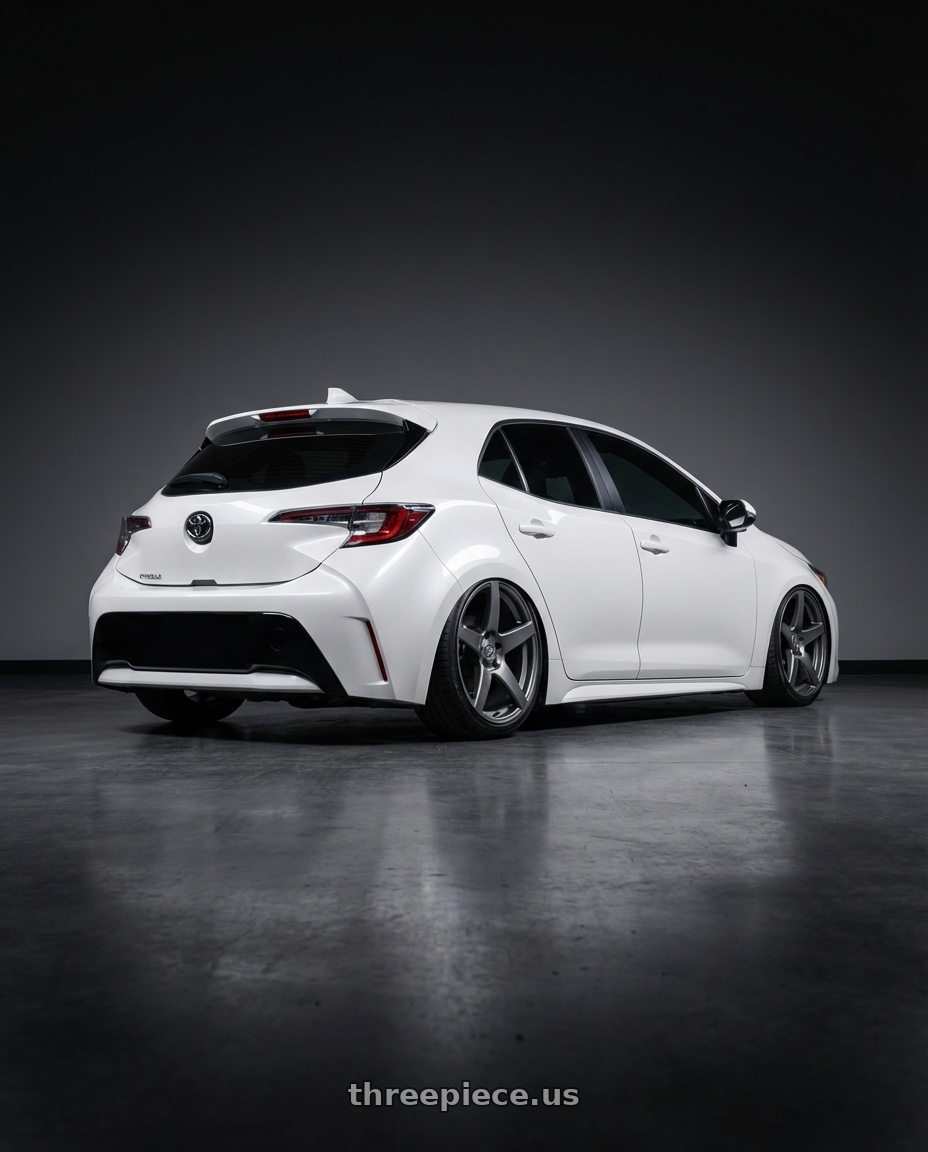 2023 Toyota Corolla Hatchback with Forgestar CF5 5x114.3 18x9 +35 Gloss Anthracite wheels rear three quarter view slight stretch tires