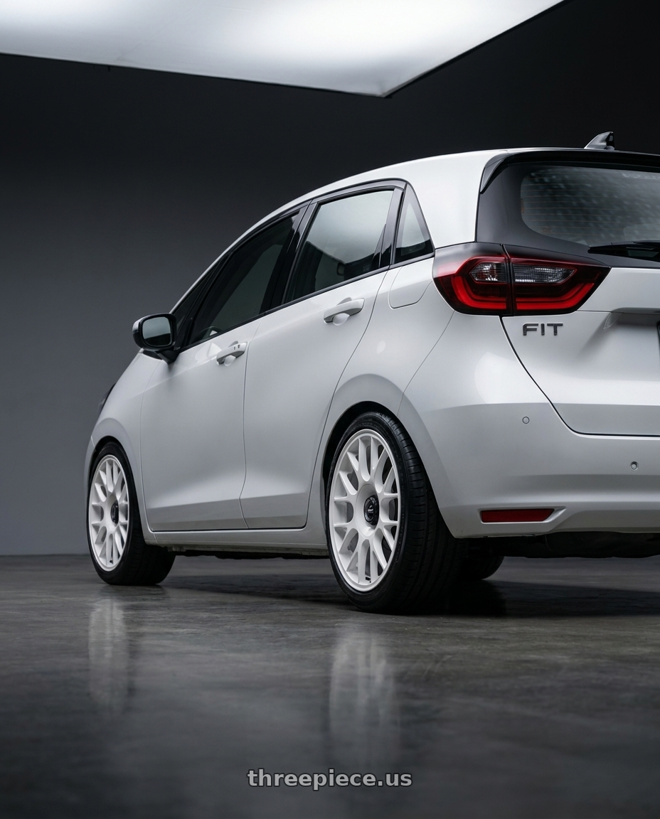 2021 Honda Fit with fifteen52 APEX 4x100 / 4x108 17x7.5 +42 RALLY WHITE (GLOSS WHITE) wheels rear three quarter view slight stretch tires