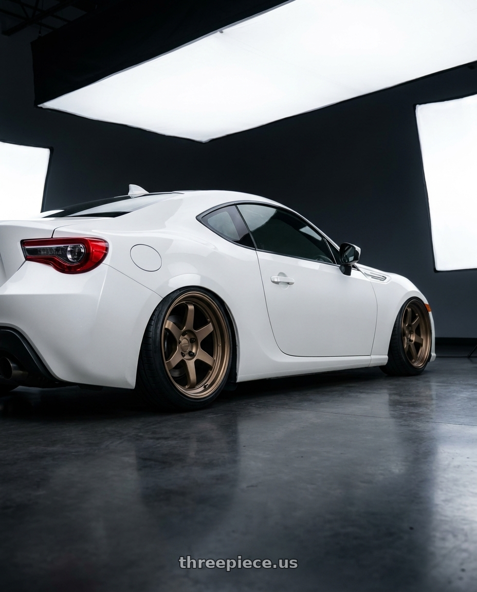 2016 Scion FR-S with Kansei K11B Tandem 5X100 18x10.5 12 Bronze wheels rear three quarter view slight stretch tires