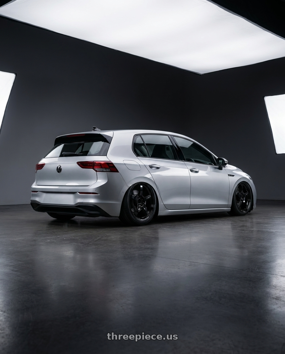 2024 Volkswagen Golf R MK8 with Gram Lights 57CR 5x112 19x9.5+25 Glossy Black wheels rear three quarter view slight stretch tires