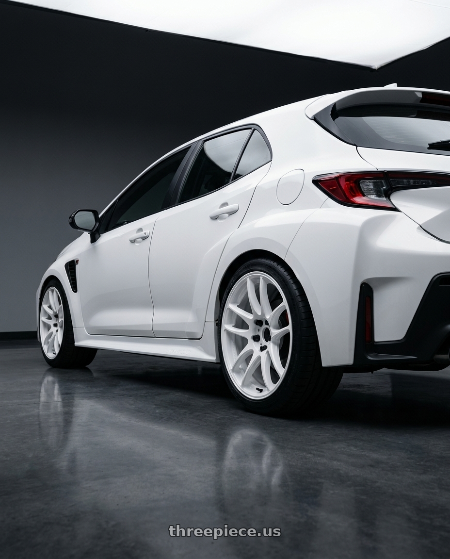 2026 Toyota GR Corolla with Work Emotion Cr Kiwami 5x114.3 18x8.5 +30 White wheels rear three quarter view square tires