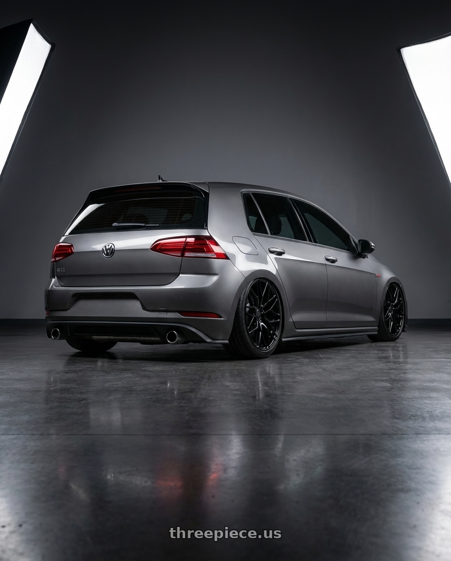 2019 Volkswagen GTI MK7 with Avant Garde Wheels M520R 5X112 19x8.5 +35 Gloss Black wheels rear three quarter view slight stretch tires