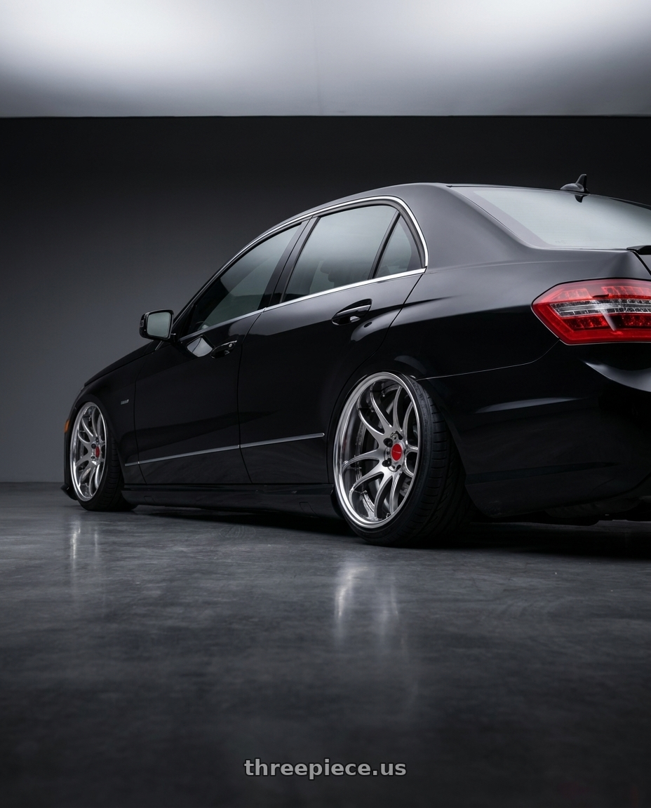 2010 Benz E550 with Work Cr 2P 4x100 17x10.0 +22 GT Silver wheels rear three quarter view slight stretch tires