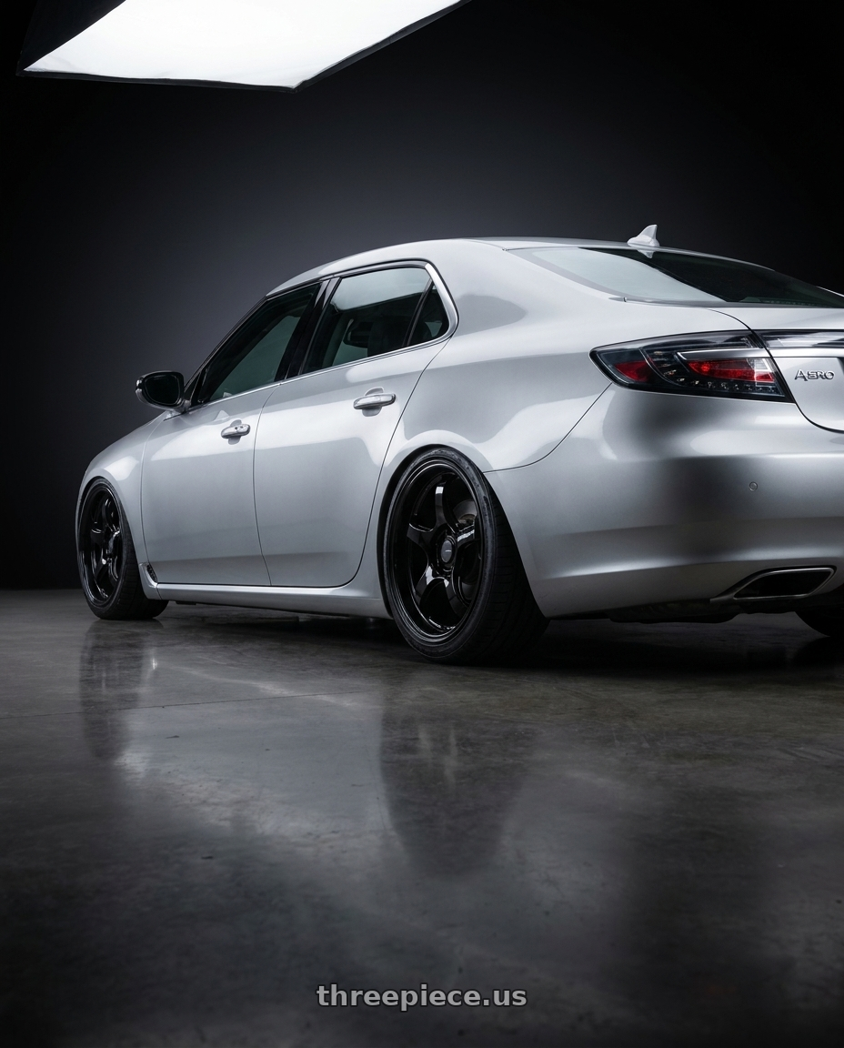 2012 Saab Aero 95 with WedsSport RN-05M 5x114.3 19x10.5+32 Gloss Black wheels rear three quarter view slight stretch tires