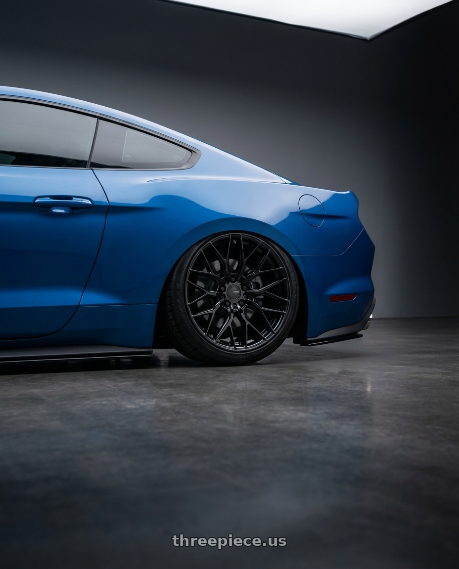 2022 Ford Mustang GT with Avant Garde Wheels M520R 5X114.3 20x10.5 +45 Gloss Black wheels rear three quarter view slight stretch tires