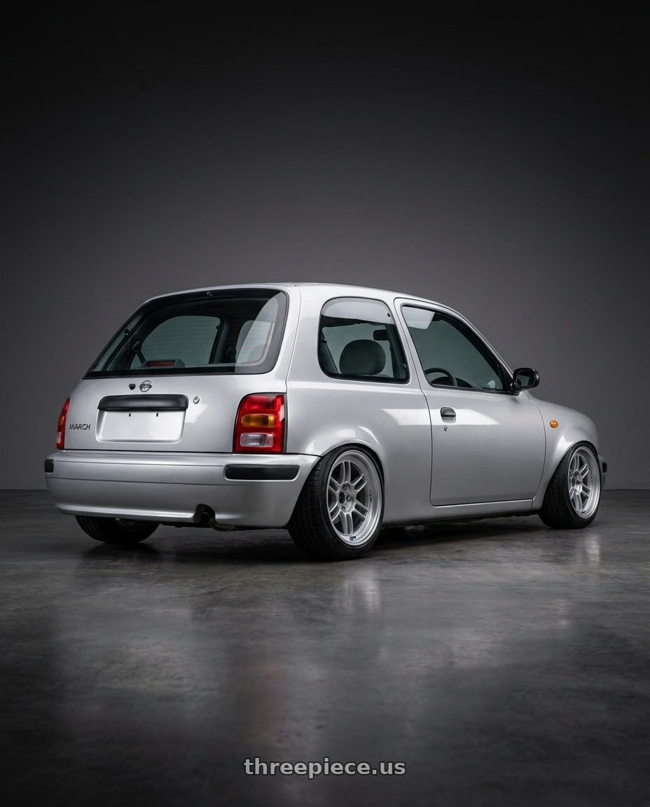 1998 Nissan march with Enkei RPF1RS 5x114.3 18x10+6 Silver wheels rear three quarter view slight stretch tires