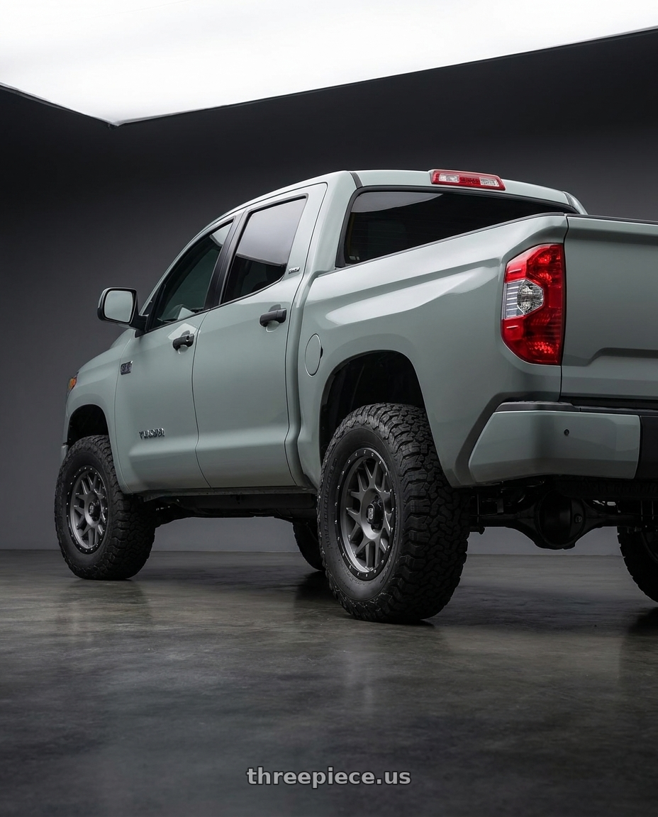 2018 Toyota Tundra with XD XD127 BULLY 5X150 20X9 +0 MATTE GRAY BLACK RING wheels rear three quarter view meaty tires