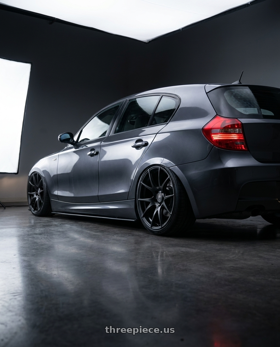 2012 BMW 1 Series E82 with Forgestar CF5V 5x120 19x9 +38 Satin Black wheels rear three quarter view slight stretch tires