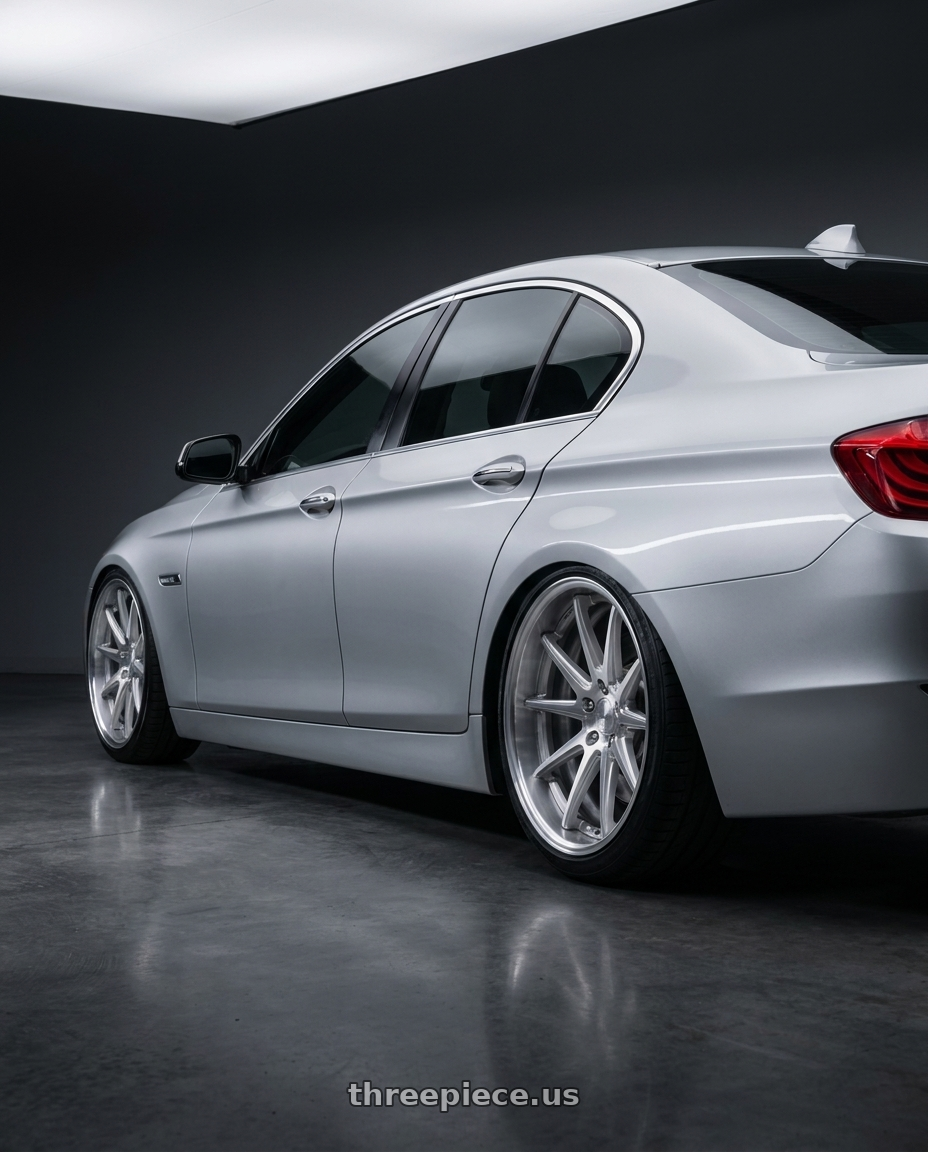 2010 bmw 535 silver with Work Gnosis Cv201 5x114.3 19x9.5+45 O Disk Brush Silver Clear wheels rear three quarter view slight stretch tires