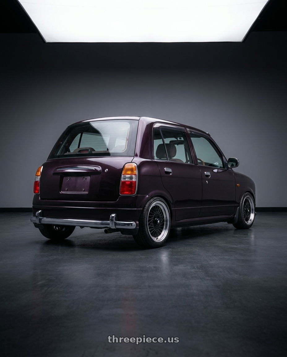 2000 Daihatsu Mira Gino with Enkei Enkei92 Classic Line 4x100 15x7+38 Black wheels rear three quarter view slight stretch tires