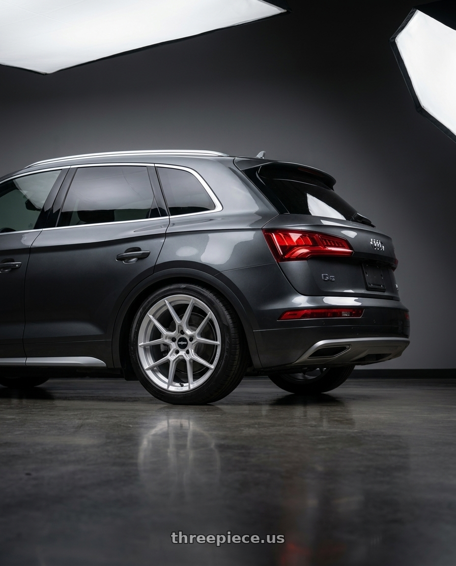 2021 Audi Q5 Premium Plus with Rotiform RC199 KPR 5X112 20x9 +25 SILVER wheels rear three quarter view slight stretch tires