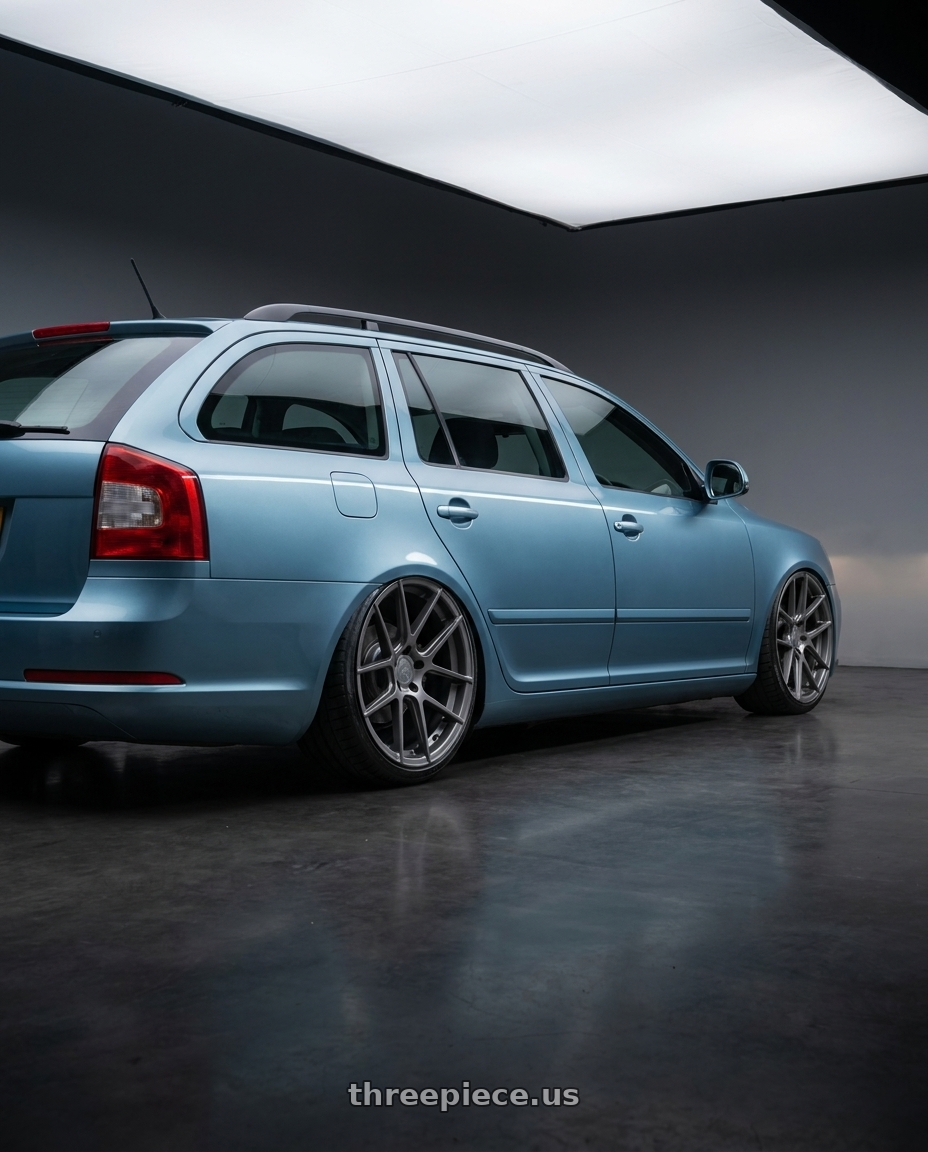 2012 Skoda Octavia Combi 12 Tsiaqua Blue Metallic with Avant Garde Wheels M510 5X130 19x11 +52 Dolphin Grey wheels rear three quarter view slight stretch tires