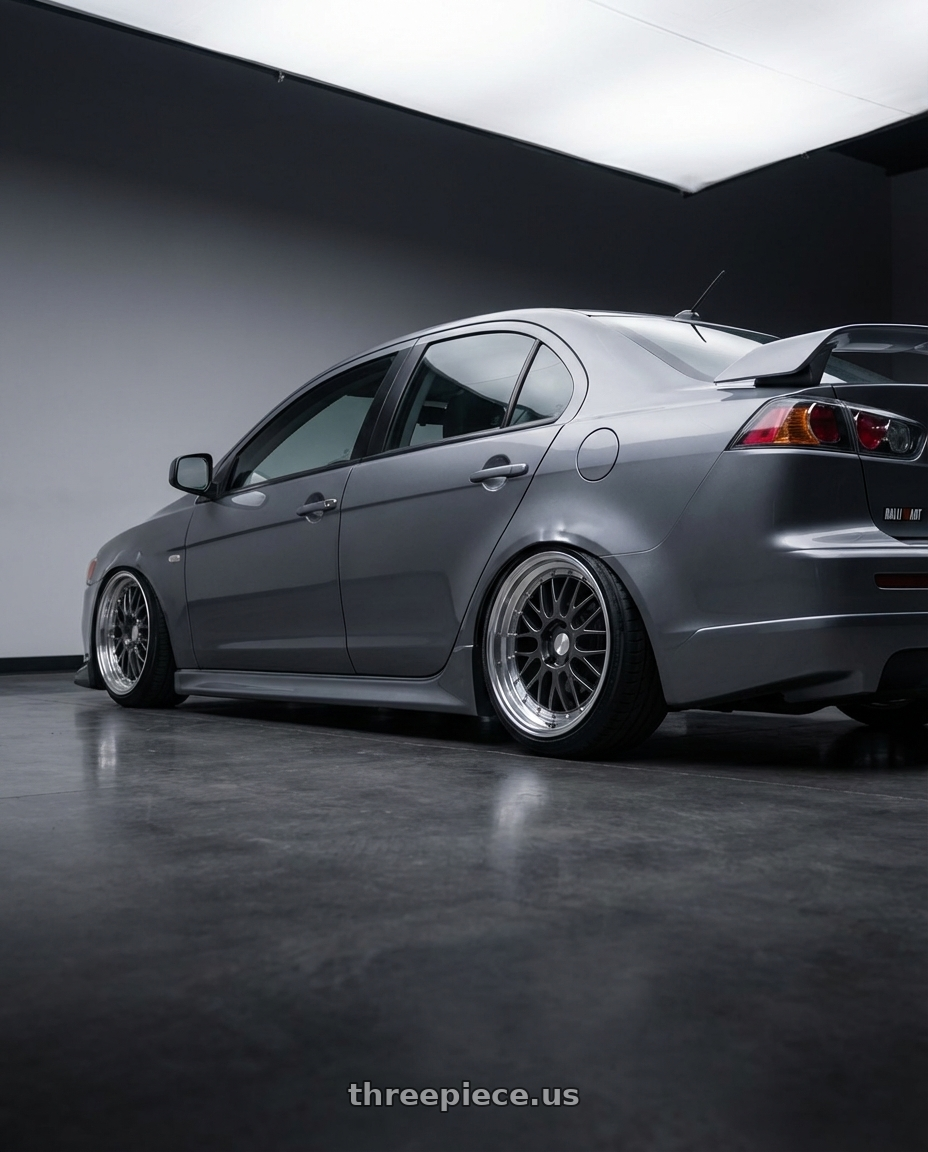 2014 Mitsubishi Lancer Ralliart with ESR Wheels SR SERIES SR05 5x114.3 18x9.5 +35 Gloss Graphite wheels rear three quarter view slight stretch tires