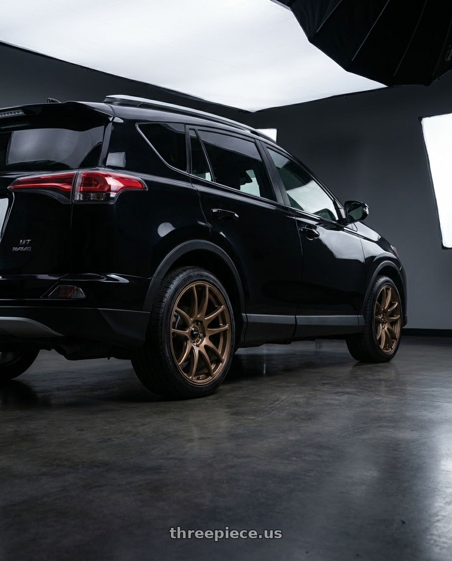 2017 Toyota Rav4 with Vors TR4 5x114.3 17x8 +35 Bronze wheels rear three quarter view square tires
