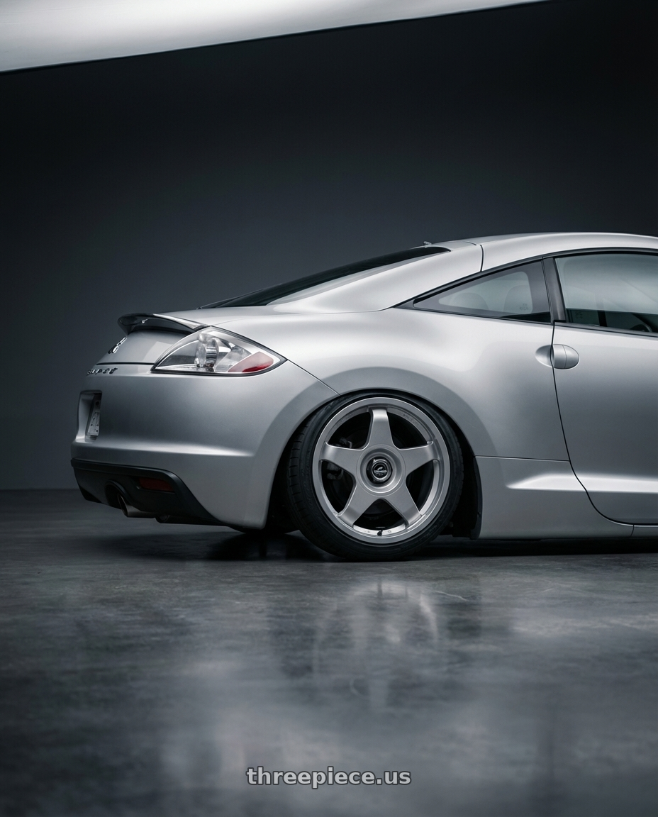 2010 Mitsubishi Eclipse with fifteen52 CHICANE 5x114.3 / 5x120 19x8.5 +35 SPEED SILVER (GLOSS SILVER) wheels rear three quarter view slight stretch tires