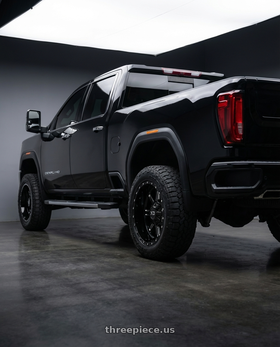 black 2020 gmc duramax 2500 hd denali with XD XD838 MAMMOTH 8X180 22X10 +12 GLOSS BLACK MILLED wheels rear three quarter view square tires
