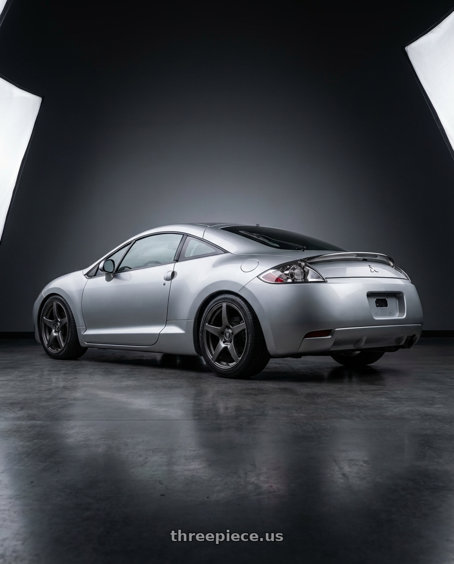 2010 Mitsubishi Eclipse with Forgestar CF5 5x114.3 18x10 +42 Gloss Anthracite wheels rear three quarter view square tires