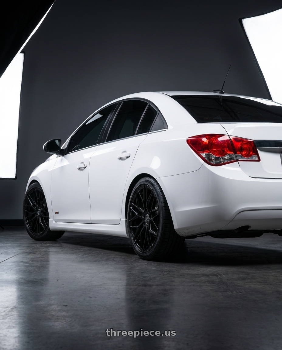 2012 Chevy cruze white with AXE WHEELS EX44 5x105 18x8.5 +40 Gloss Black wheels rear three quarter view square tires