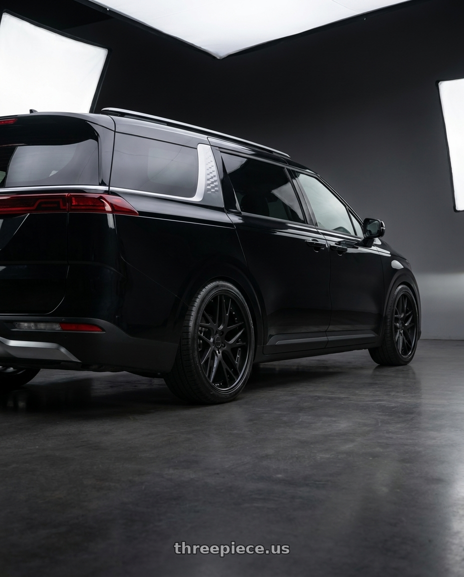 2024 Kia carnival with Work Gnosis Cvx 5x114.3 22x9+45 A Disk Matte Black wheels rear three quarter view square tires