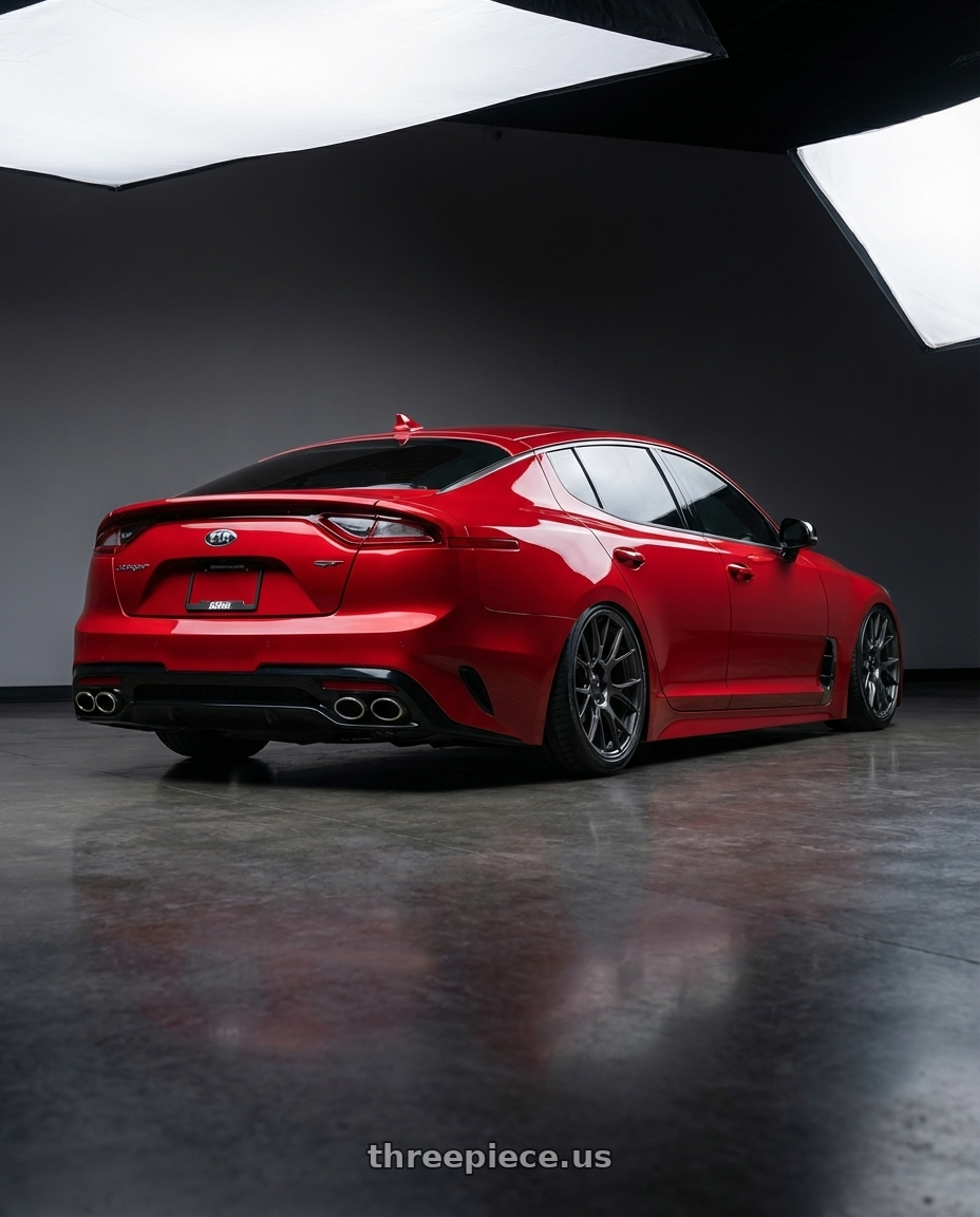 2022 Kia Stinger GT with Konig Ampliform 5x114.3 19x9.5+25 Dark Metallic Graphite wheels rear three quarter view slight stretch tires