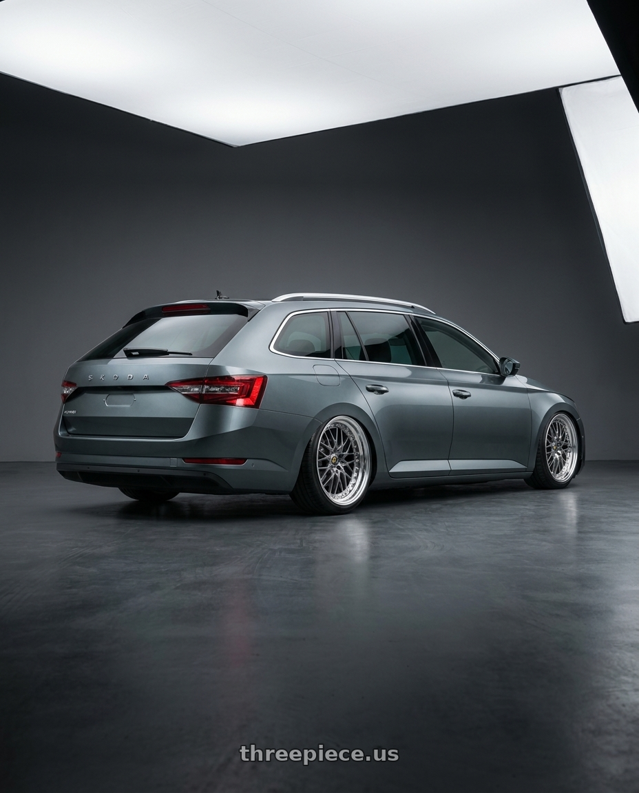 2021 Skoda superb combi with Work Vs-Xv 5x100 18x9+40 A Disk Brilliant Silver Black wheels rear three quarter view slight stretch tires