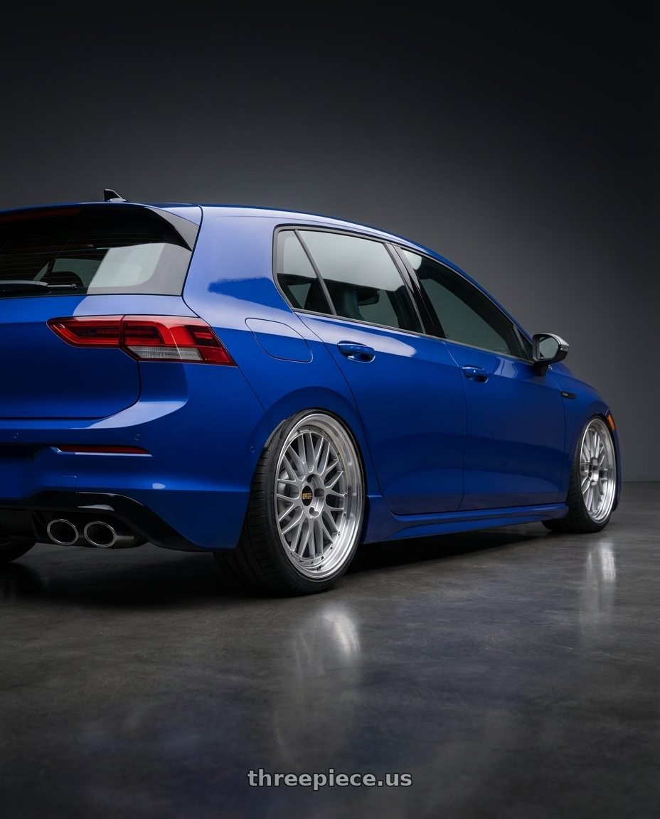 2026 Volkswagen Golf R with BBS LM 5x112 19x9.0+42 Diamond Silver wheels rear three quarter view square tires
