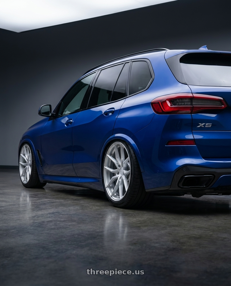 2023 bmw x5 blue with Aodhan AFF1 5x120 20x10.5+35 Gloss Silver Machined Face wheels rear three quarter view slight stretch tires