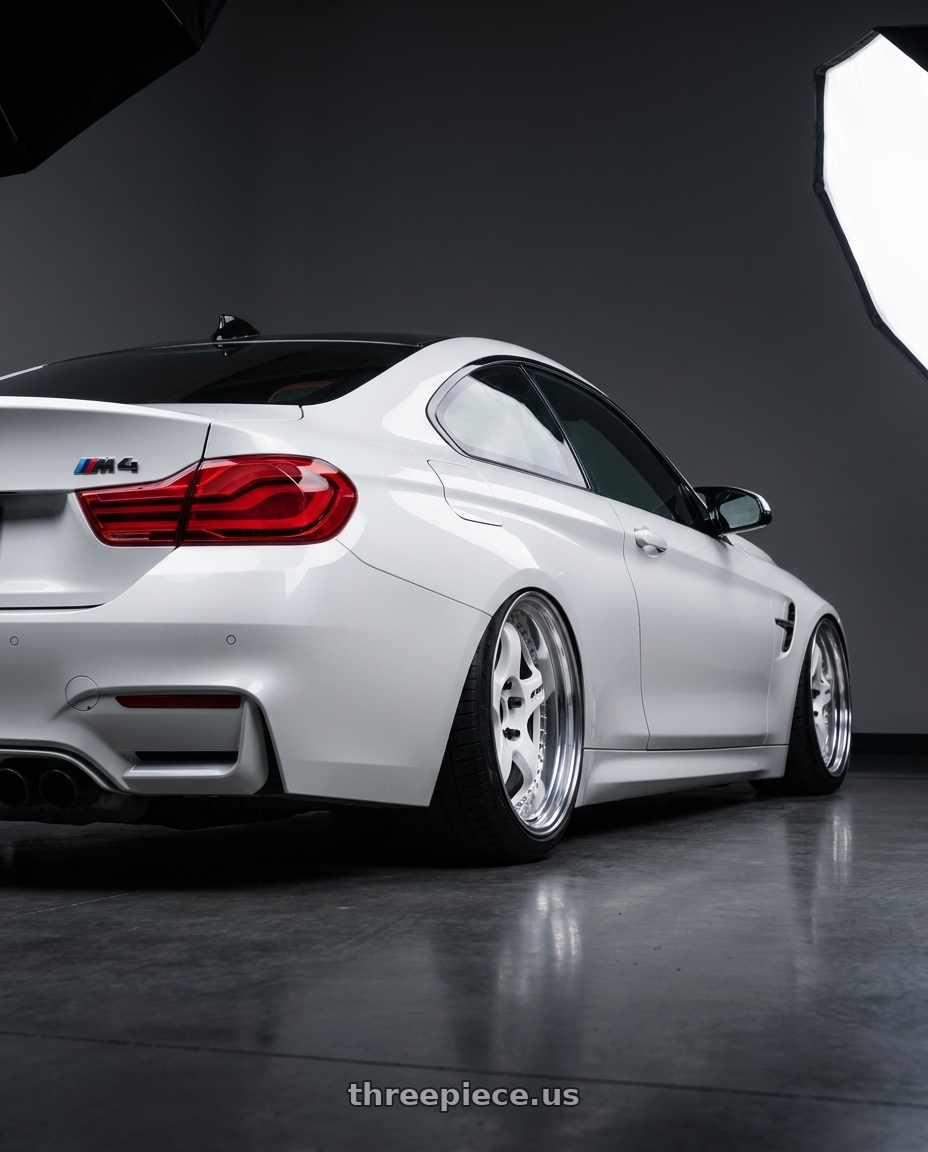 2018 BMW M4 with Work Meister S1 3P 5x120 19x10.5+23 O Disk White wheels rear three quarter view square tires