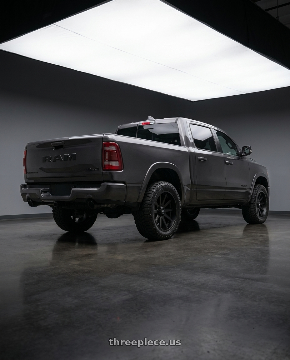 2021 Ram 1500 Laramie with Ion Type 143 6x139.7 20x9+18 Matte Black wheels rear three quarter view square tires