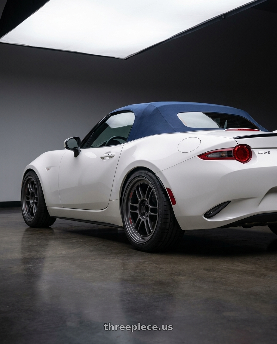 2021 Mazda Miata MX-5 Arctic with Enkei RPF1RS 5x114.3 18x10.5+0 Matte Gunmetal wheels rear three quarter view square tires