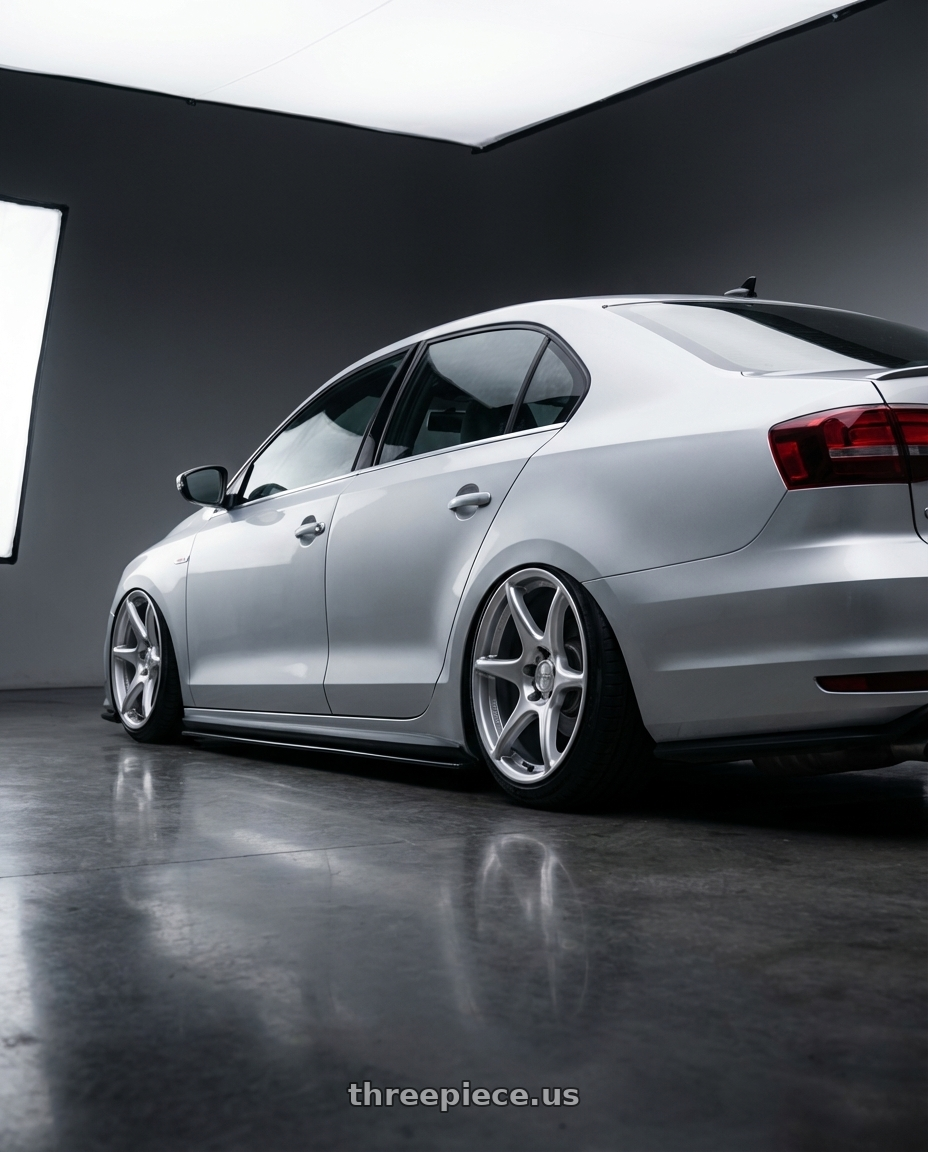 2016 Volkswagen Jetta GLI MK6 with Kansei K11S Tandem 5X112 18x8.5 35 Hyper Silver wheels rear three quarter view slight stretch tires