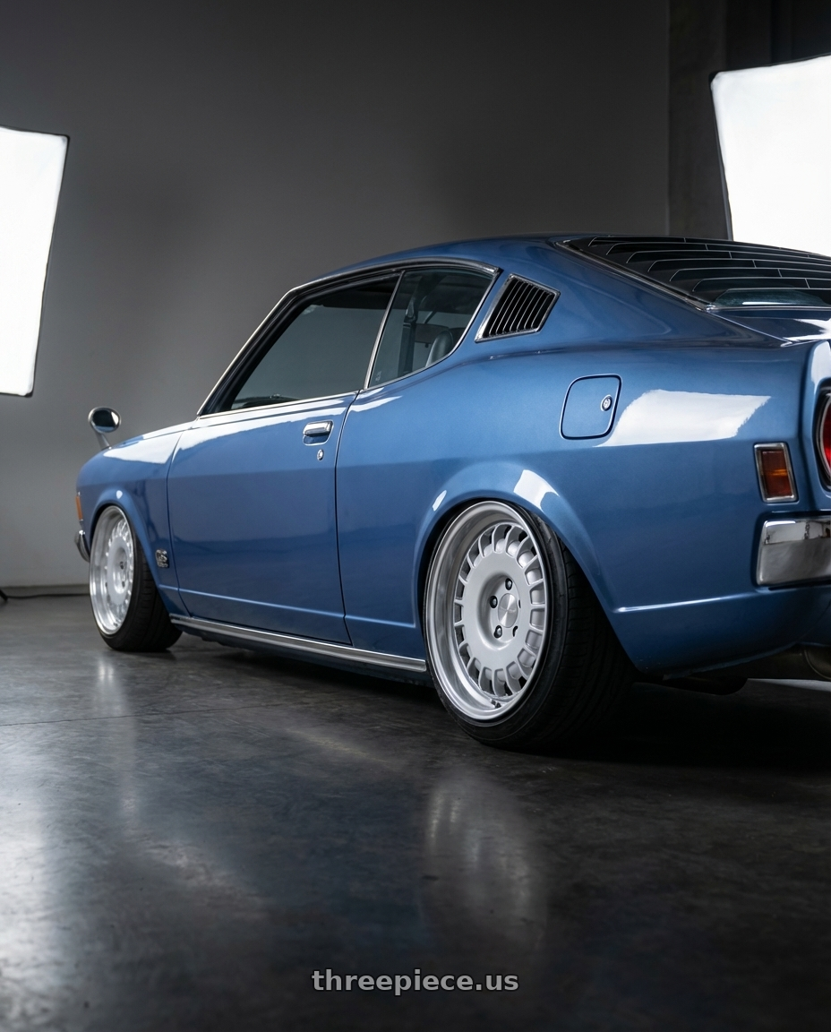 1974 Mitsubishi GTO with Rotiform RC205 PMF 5X112 18x8.5 +45 GLOSS SILVER wheels rear three quarter view extreme stretch tires