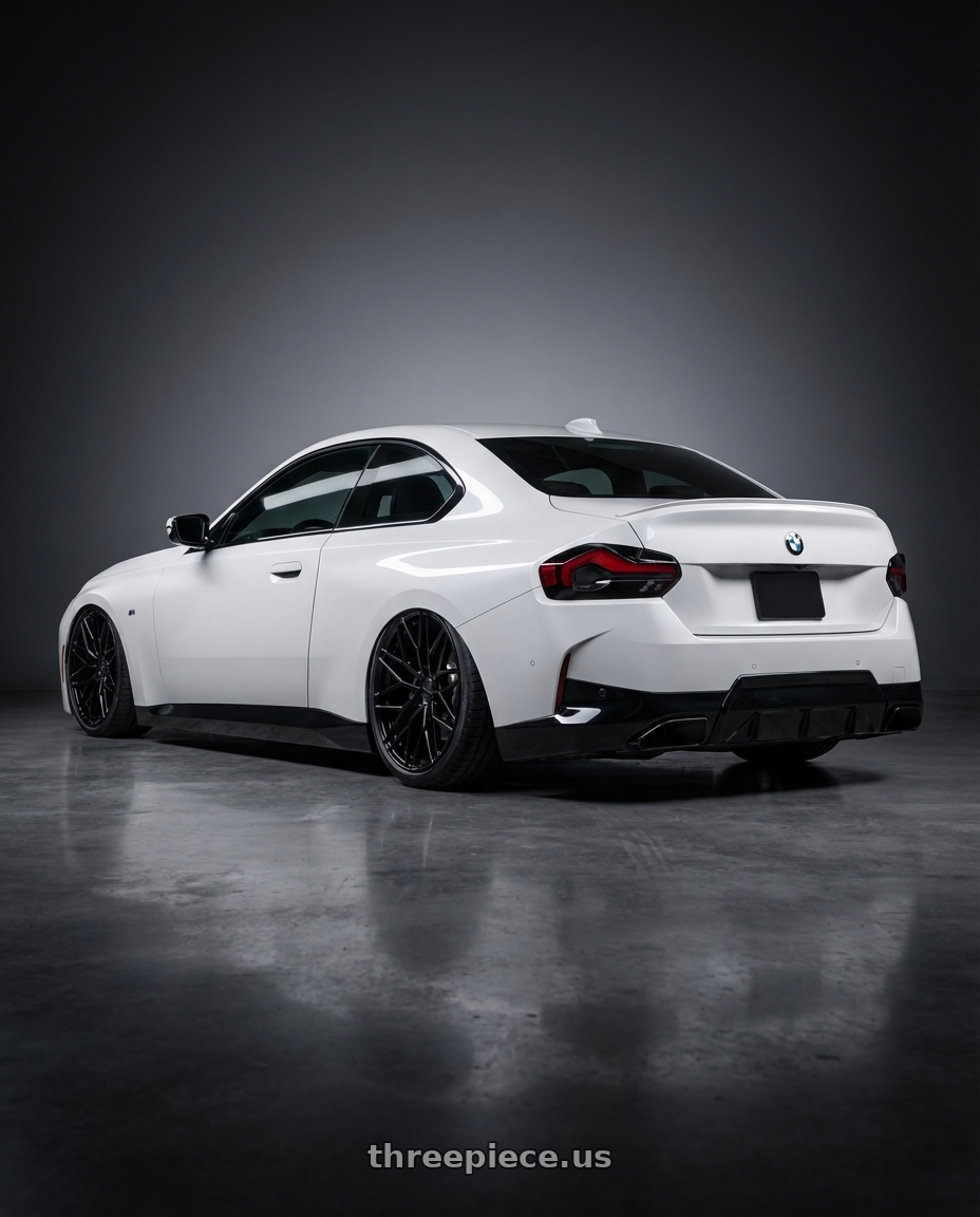 2024 BMW 2 Series G42 with Avant Garde Wheels M520R 5X112 19x8.5 +35 Gloss Black wheels rear three quarter view slight stretch tires