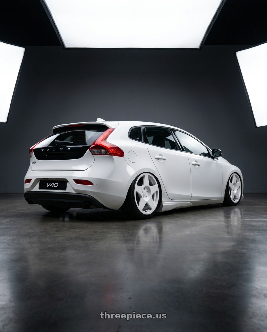 2015 Volvo V40 with fifteen52 TARMAC 5x108 18x8.5 +42 RALLY WHITE (GLOSS WHITE) wheels rear three quarter view square tires