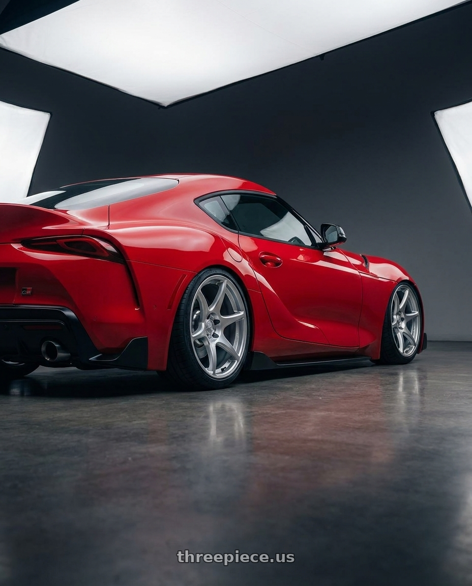 2023 Toyota GR Supra with Kansei K11S Tandem 5X112 19x9.5 22 Hyper Silver wheels rear three quarter view slight stretch tires