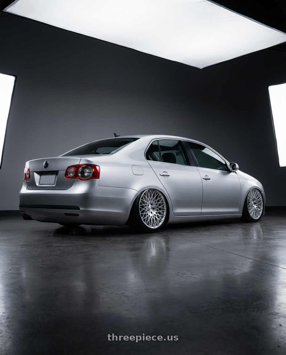 2009 Volkswagen Jetta GLI MK5 with Avant Garde Wheels M540 5X112 18x9 +48 Silver Machined wheels rear three quarter view slight stretch tires