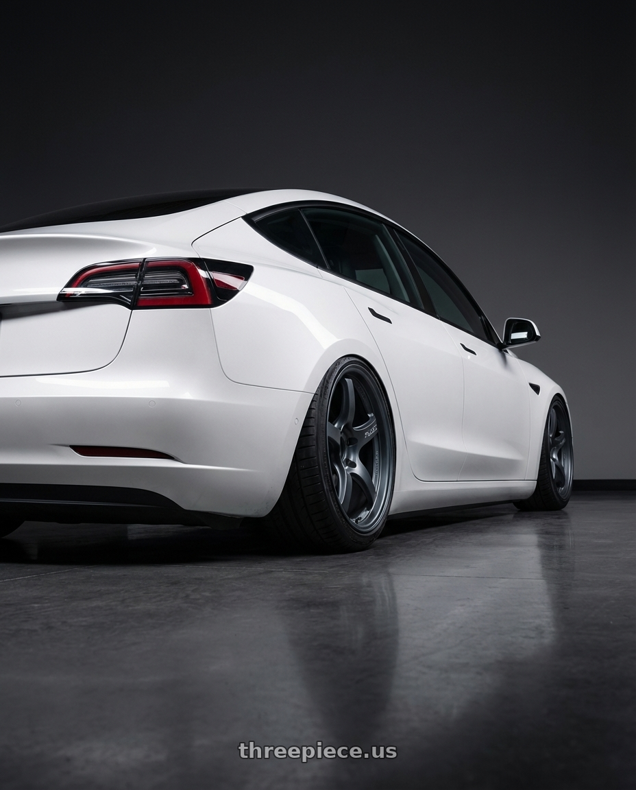 2023 Tesla Model 3 with Gram Lights 57CR 5x114.3 19x9.5+45 Gunblue II wheels rear three quarter view slight stretch tires