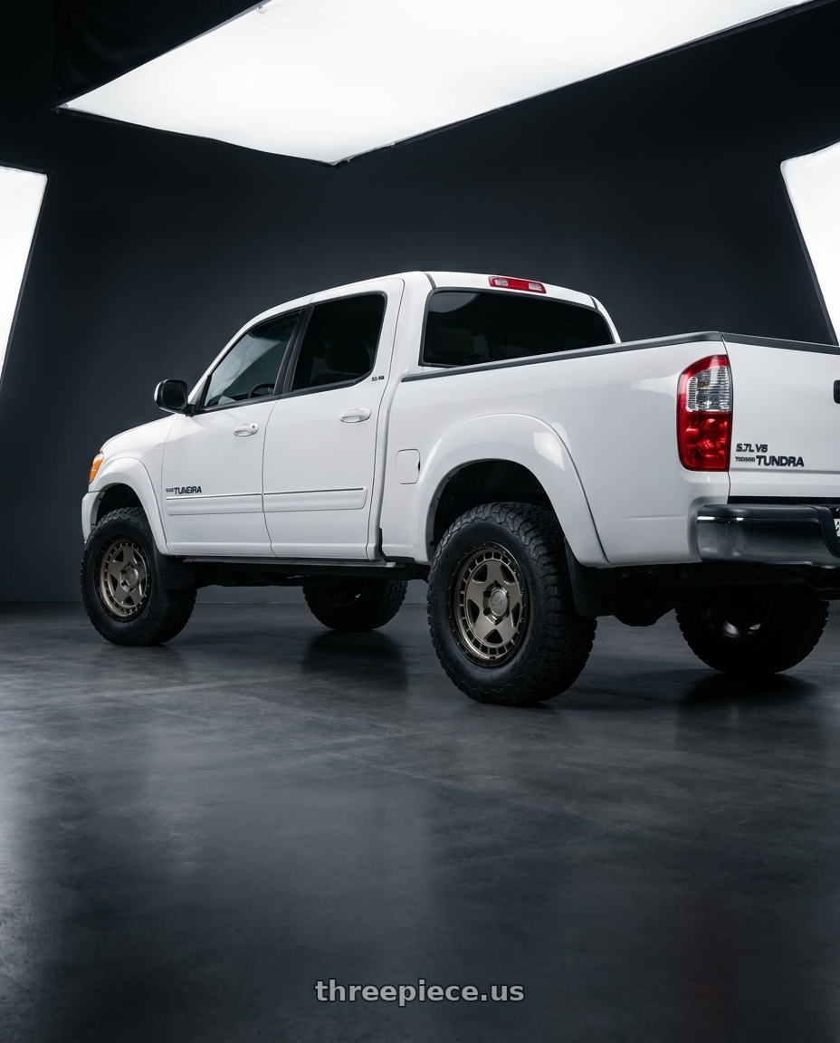 2006 Toyota tundra with fifteen52 TURBOMAC HD 6x139.7 17x8.5 +0 MAGNESIUM GREY (SATIN BRONZE/SATIN BLACK RING/BLACK HARDWARE) wheels rear three quarter view meaty tires