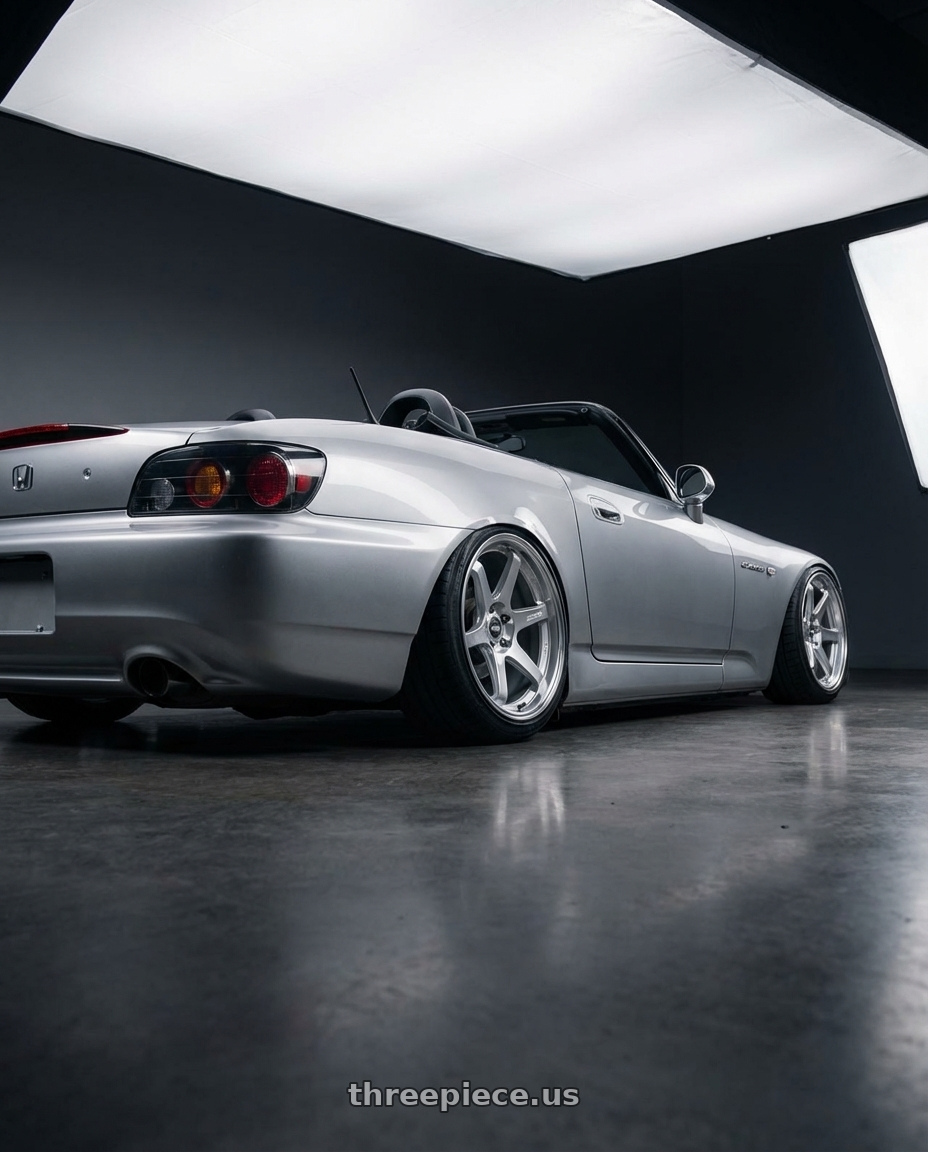 2009 Honda S2000 with ESR Wheels APEX SERIES AP6 5x114.3 18x9.5 +22 Hyper Silver wheels rear three quarter view slight stretch tires