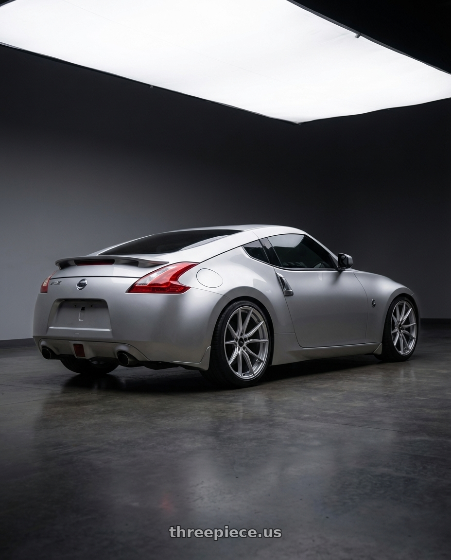 2013 Nissan 370z touring, silver with Advanti Racing 80S Hybris 5x114.3 20x8.5 +40 Silver with Machined Face wheels rear three quarter view slight stretch tires