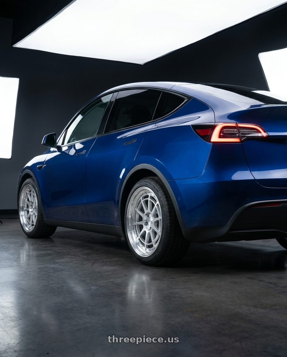 2023 Tesla Model Y with Aodhan AH04 5x114.3 18x9.5+30 Silver w/Machined Face wheels rear three quarter view square tires